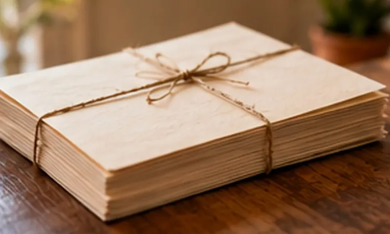 A stack of printed pages tied with string on a timber table